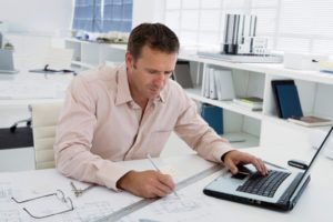 The Person working on laptop in office at Los Altos, CA 